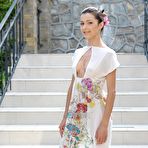 First pic of Brunette babe Divina A is shamelessly getting absolutely naked on the outdoor stairs