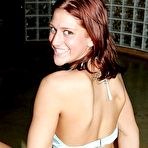 Fourth pic of Busty red haired Eve Lawrence strangles a pulsating boner with both of her silky hands.