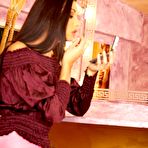 First pic of Spicy posing scene from gorgeous brunette babe Evelyn Lory in purple fishnets and short skirt