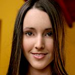 Third pic of Cute brunette Erica Ellyson with perky boobs removes her green dress in the backyard