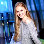 First pic of Blonde and busty teen Nancy A shows off her incredible body in a big grey sweater.