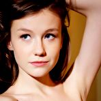 First pic of Brunette teenie Emily Bloom is slowly stripping uncovering every inch of her shaved cunt