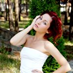Third pic of Redhead hottie with a great bod Night A poses in her white dress and flashes hot pussy outdoors