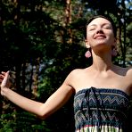 Fourth pic of Lovely softcore brunette girl Loreen A is smiling for the camera as she strips outdoors