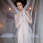 First pic of Curly haired brunette Loretta A poses showing her naked pussy with puffy labia