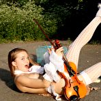 Fourth pic of Sexy girl Milena D is playing the violin outdoor in nothing but stockings and garter belt