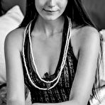 Third pic of Petite teen Vanessa Angel lets her long brunette hair down and shows her un shaved pussy.