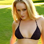 Fourth pic of Kristine rocking some bikinis at the park.