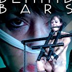 Fourth pic of SexPreviews - Alana Cruise behind bars and bound in metal with her pussy exposed