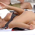 Fourth pic of Rita Rusic boobslip and flashes shaved pussy