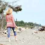 First pic of Neighbor lady shows tits and toes at the beach