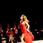 First pic of Rose McGowan shows her sexy legs at red dress fashion show