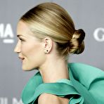 Third pic of Rosie Huntington-Whiteley side of boob in green dress