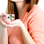 First pic of Marta E enjoys a cup of coffee before she start stripping on the sofa