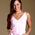 First pic of Lovely young brunette Irina Bruni bends over for the camera to make juicy softcore porn