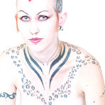 First pic of Tattooed punk girl Jax in corset and boots impales her pierced pussy on dildo