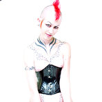 Fourth pic of Tattooed punk girl Jax in corset and boots impales her pierced pussy on dildo