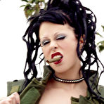 Fourth pic of Smoking gothic girl Eva Klench shows off her tattoos and pierced pussy on the roof