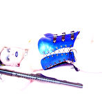 Fourth pic of Gun girl Jenner Christ with tattoos and piercing poses in blue corset and black boots