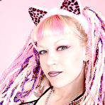 First pic of Alternative blonde Chaotica with pink and white hair shows her pierced nipple and bald pussy