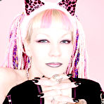 Second pic of Alternative blonde Chaotica with pink and white hair shows her pierced nipple and bald pussy