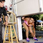 Second pic of Bosomy brunette Vanilla Deville sucking rod, squeezing it between boobs and getting cum on face