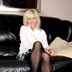 First pic of Blonde mom masturbating on the couch