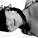 Third pic of Sexy teen with beautiful breasts is tied and laying in bed.