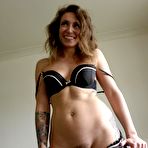 Second pic of Dirty Brit Ava Austen strips her red dress and sexy black undies spread-eagling in her purple pumps