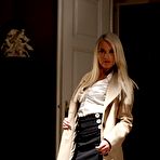 First pic of Elegant blonde Lena Love strips and spread-eagles on a leather sofa in her black holdups