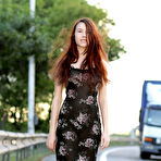 First pic of Cute long haired bombshell undressing and demonstrating naughty quim outdoor in the field.