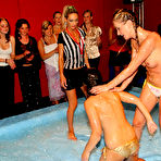 Third pic of Samantha Wow and her opponent lose their tops and bare their tits after oil wrestling match begins