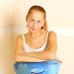 First pic of Stripping her white top and jeans skirt Dasha Nubiles poses on the chair