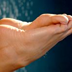 Third pic of Stacked blonde Anita Dark demonstrates her naughty parts and feet at the poolside