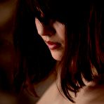 Second pic of The seducing brunette teen Cassie Laine is topless playing with the nice black lace panty