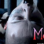 Fourth pic of SexPreviews - Luna LaVey bound in metal with tits exposed and pussy toyed in dungeon