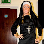 Third pic of Shaved pussy nun Krystal Niles takes off her uniform and lingerie after cock domination
