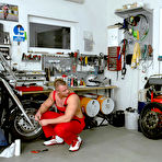 First pic of Muscle guy in red uniform gets his cock ridden by Celine Noiret in black stockings and suit