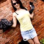 Second pic of Adrianne in a yellow top and tiny jean skirt