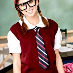 First pic of The licentious college girl Riley Reid stripping off uniform and showing lingerie in the classroom