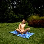Fourth pic of Babe Riley Reid is setting her naked body on the green lawn and masturbating beaver