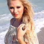 First pic of Nikita at the beach strips out of her bikini