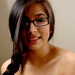 Third pic of Foxy schoolgirl in glasses getting stripped and exposing her moist.. at Teenage Pussy Pic