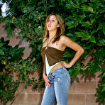 First pic of Shaved pussy chick Jennifer Jade removes her blue jeans and white thong panties outdoors