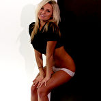 Third pic of Softcore chick Kendra Rain is posing in the panty thong and shaking nude boobs