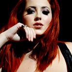 Fourth pic of Horny redhead teen Lucy Vixen shows big tits naked and touches the pussy slit