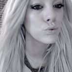 Second pic of Black and white blonde Xo Gisele sends kisses while posing in extra kinky lingerie.