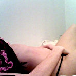 Fourth pic of Freckles is a lithe brunette and she is teasing her fans by stripping out of her lingerie in bed