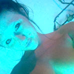 Third pic of Freckles looks almost like in a softcore porn in the solarium showing off her nice big boobs.