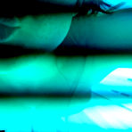 Fourth pic of Freckles looks almost like in a softcore porn in the solarium showing off her nice big boobs.